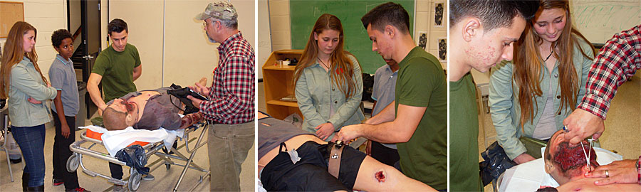 Cadets work with a medical mannequin